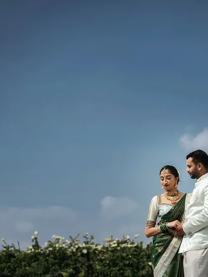 A quiet moment together under a wide, open sky. This style of wide-angle photography emphasizes the environment, making it a key character in your pre-wedding narrative.