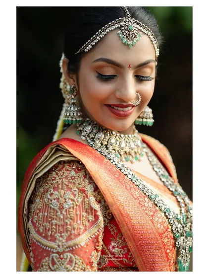 A beautiful downward glance showcasing the detailed eye makeup. We focused on elegant, defined lashes and a soft shimmer to make her eyes pop.