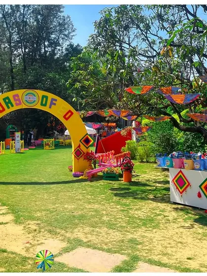 The entrance to the 'Colors of EO' Holi party featured a bright yellow archway, setting a joyful and welcoming tone for the celebration.