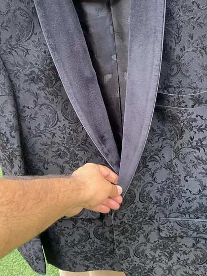 For the Big Boss 16 finale, I chose this black jacquard fabric for Salman Khan's jacket. The texture and subtle pattern add a touch of luxury to his signature all black look.