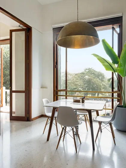 Our office is designed to connect with its surroundings. The dining area opens onto a balcony overlooking the trees, providing a space for our team to pause, connect, and draw inspiration from the natural light and energy of the city.