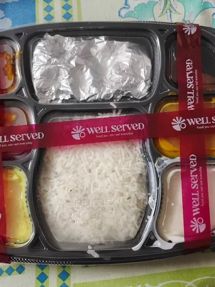 This is how your thali arrives, securely packed and sealed with my 'Well Served' ribbon. I make sure everything stays in its place so you can enjoy a perfect meal, every time.