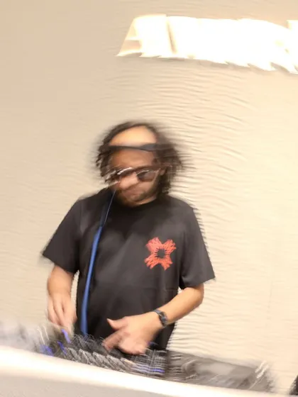 A motion-blur photo capturing the energy of my set at the Amiri store launch. Even in a retail environment, I bring a dynamic presence.