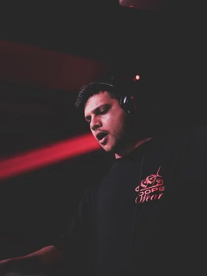 A shot of me singing along to the track I'm playing. I'm passionate about the music and I get into it just as much as the crowd.
