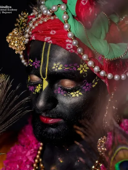 A close-up of the Krishna makeup, showing the detailed face painting and the serene expression created through the art of makeup.