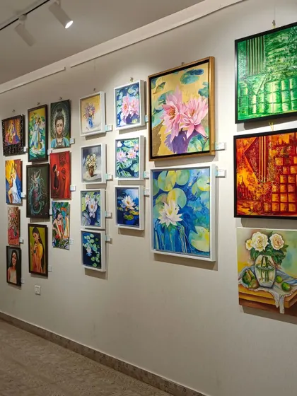 A view of a group exhibition at our gallery, featuring a beautiful collection of floral and spiritual paintings. We curate shows that highlight the incredible talent within the Indian art community.