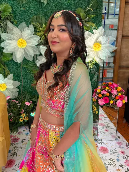 Another happy shot of the bride. The soft curls and fresh makeup are perfect for a night of dancing and celebration.