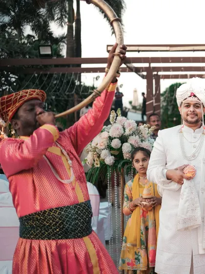A traditional musician announces the groom's arrival. We document all the cultural elements and vendors that make your wedding day unique.