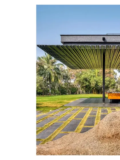 Details make architecture. A view of the pergola at the Lakeshore house, showing the clean lines of the steel structure and the texture of the stone pavers below.