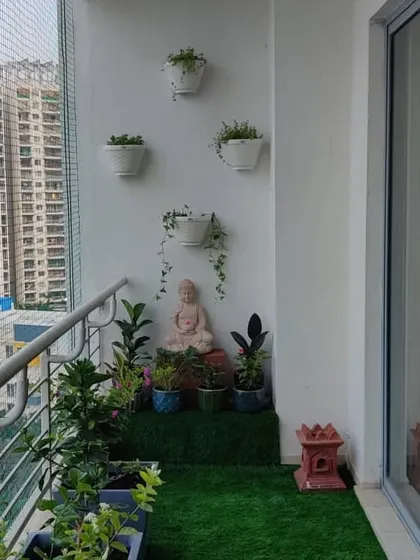 This angle shows the full layout, including the safety netting, which we can work with to ensure your balcony is both beautiful and safe for everyone.