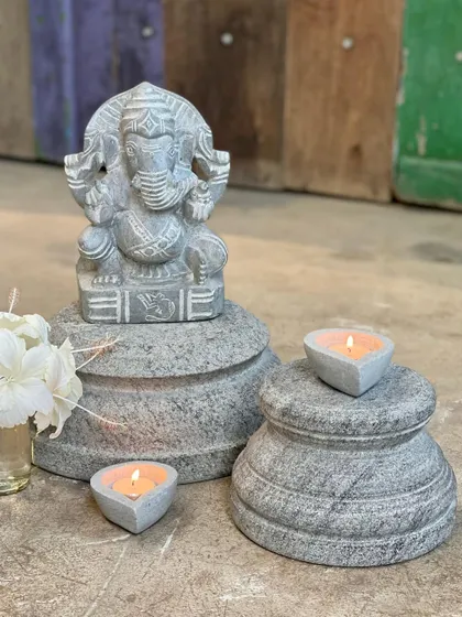 A small Ganesha statue is elegantly displayed on our handcrafted stone plinths, showing how you can elevate your favorite decor pieces.