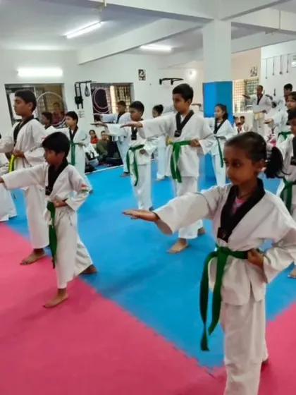 Students practicing a knife-hand block.