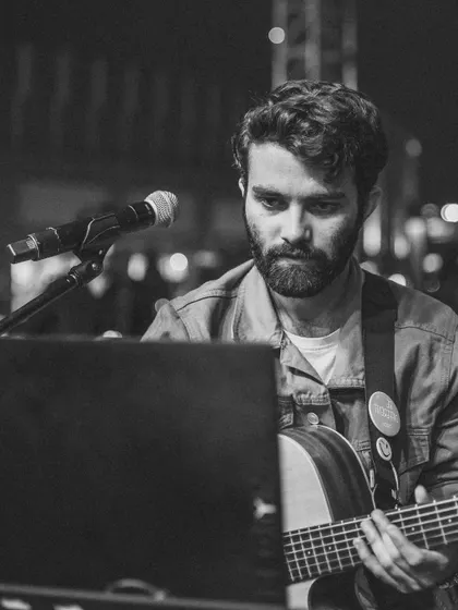 A close-up in monochrome, showing the concentration and passion that goes into every performance.