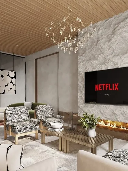 This version of the living room design explores a more rustic, natural aesthetic. A rough-hewn stone fireplace and a warm wood ceiling create a cozy, cabin-like feel, while the modern furniture keeps the space feeling fresh and current.
