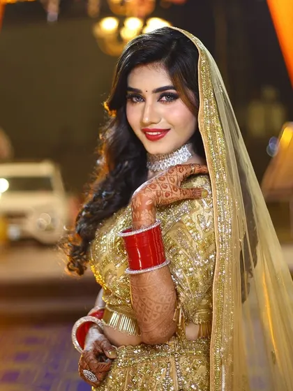 Another smiling portrait of the reception bride. Her happiness and the flawless makeup are a perfect match.