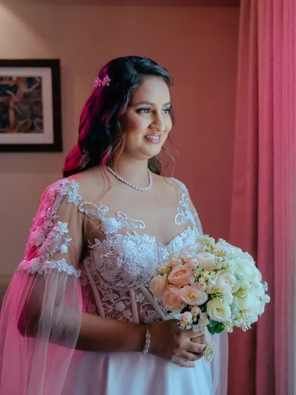 Another shot of this stunning bride. Her smile and the soft, romantic lighting create a truly magical atmosphere.