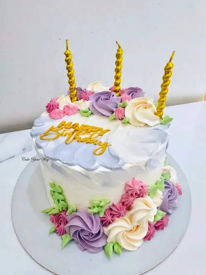 Blooming with sweetness because birthdays deserve flowers and cake. This design features a watercolor buttercream effect and beautiful piped rosettes.