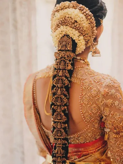 A close-up of the bride's stunning back design. The intricate embroidery and unique cut make it a true statement piece.
