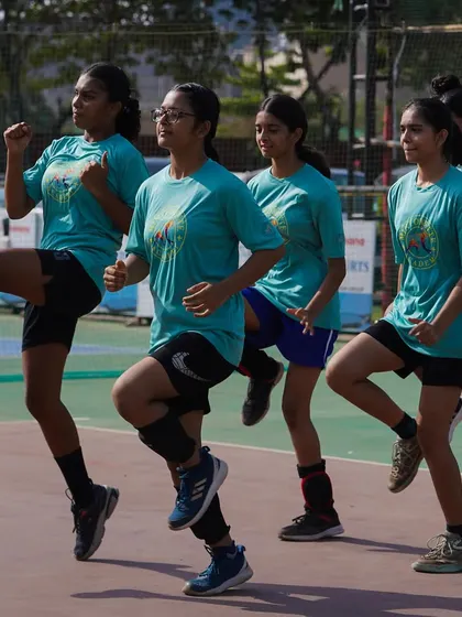 High-knee drills to improve agility and coordination. Every training session starts with a thorough warm-up to ensure our players are at their best.