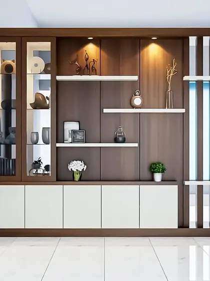 This large partition unit doubles as a crockery cabinet and display case. The combination of wood, white cabinets, and a slatted screen creates a functional and stylish divider for an open-plan space.