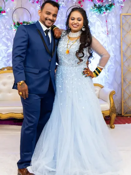 A happy couple at their reception. The bride's makeup is designed to last through the night of dancing and celebrating, keeping her looking fresh and beautiful.