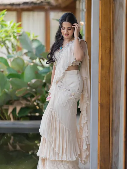 A candid shot that captures the light, airy feel of the outfit and the fresh, natural makeup.