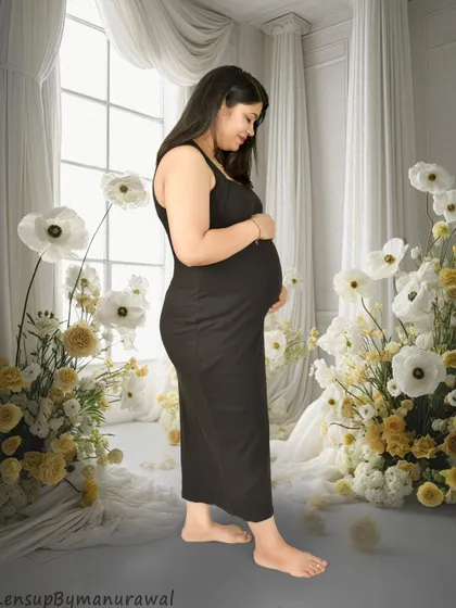 A serene portrait in a simple black dress, set against a dreamy backdrop of white and yellow paper flowers in my studio. This shows how we can use props to create a soft, artistic, and personalized setting.