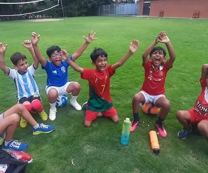 Pure excitement! The kids can't contain their joy after a fun game in our football class.