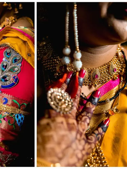 A detailed close-up of the bride's attire, focusing on the intricate peacock embroidery on her blouse and her traditional jewelry.