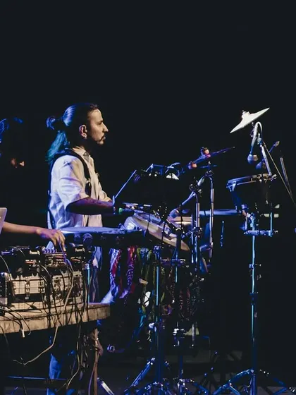 Creating memories one beat at a time. This image captures the synergy between my DJing and the live percussion, a core part of the experience I offer.
