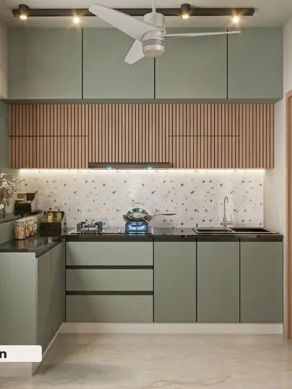 This is a beautiful kitchen design we did for a client, featuring a modern and functional layout. The combination of sage green lower cabinets and fluted wood-finish upper cabinets creates a warm, contemporary feel. The terrazzo-style backsplash adds texture and visual interest, making the space both stylish and practical.