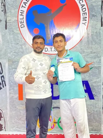 Another one of my dedicated students with his certificate and medal. I am proud of his achievement and hard work.