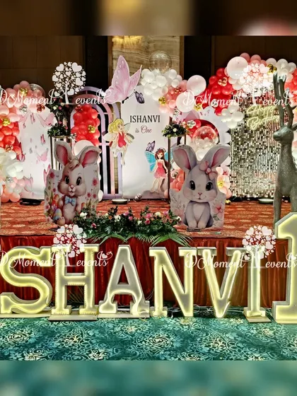 A closer view of the multi-themed stage, highlighting the cute bunny cutouts, reindeer figures, and the mix of fairy and butterfly details.