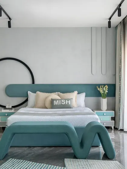 A wide view of the kids' bedroom, showcasing the custom bed with its unique "M" shaped bench, the circular wall art, and the ample natural light. The room is designed to be a sanctuary for a child to flourish.