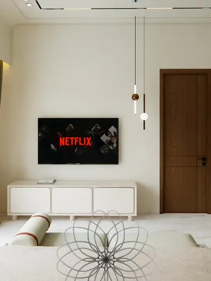 This angle of the Yūgen bedroom highlights the minimalist TV unit and the ample natural light coming from the large glass doors. The uncluttered design promotes a sense of peace and spaciousness.