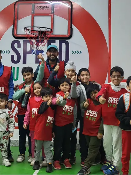 Our young guns. A group of our enthusiastic kids posing with their coaches, ready to take on any challenge.