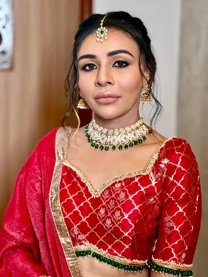 A portrait of the bride, looking confident and serene. The makeup is designed to be respectful of the religious ceremony while still feeling glamorous.