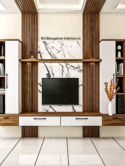 A symmetrical TV unit design featuring a central marble panel flanked by wood fluting and closed storage cabinets for a balanced and elegant look.