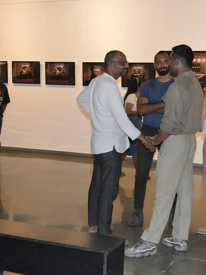 The artist in conversation with guests at his solo show preview.