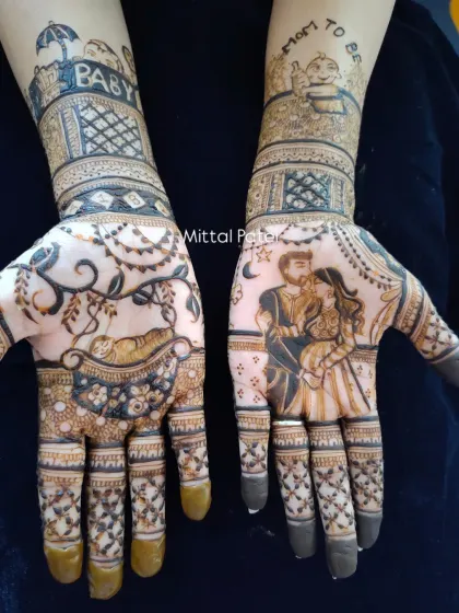 A romantic take on baby shower henna, this design includes a portrait of the expecting couple. The other hand features a baby in a cradle, with "Mom to be" and "Baby" written on the arms.
