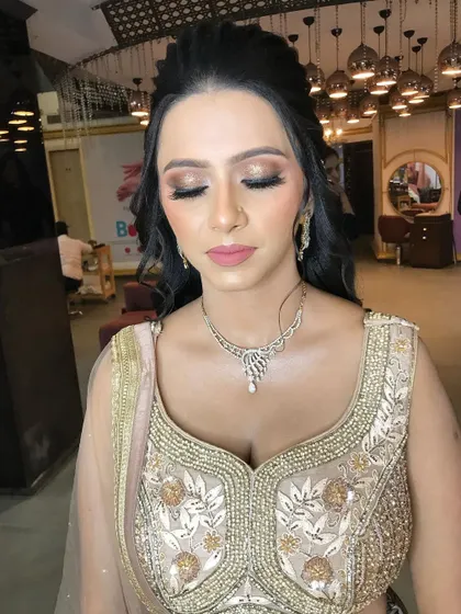A view with eyes closed to showcase the clean and blended eyeshadow work. I used a mix of matte and shimmer shades for a multi-dimensional effect.