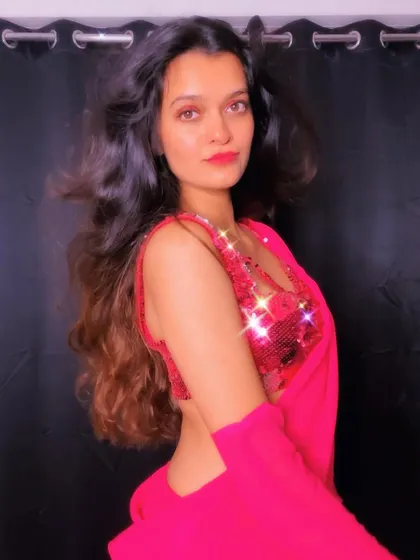 Another angle of this modern saree look, showing the backless design and the flow of the fabric.