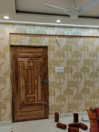 A room with a repeating tree pattern wallpaper, covering multiple walls for a cohesive and immersive look.