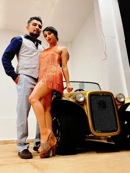 Roaring 20s baby. A fun shot from a Gatsby themed party, complete with a vintage car. We love a good theme party.