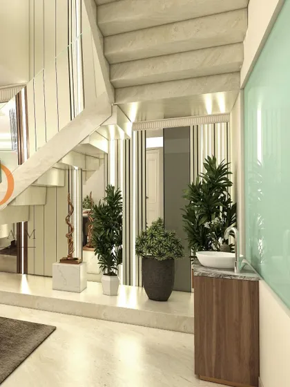 A detail of the space under the stairs, which has been thoughtfully designed with planters and a wash basin, making use of every square foot.