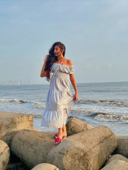Standing on the tetrapods by the sea, enjoying the coastal breeze. These are the moments of quiet contemplation we build into every beach destination itinerary.