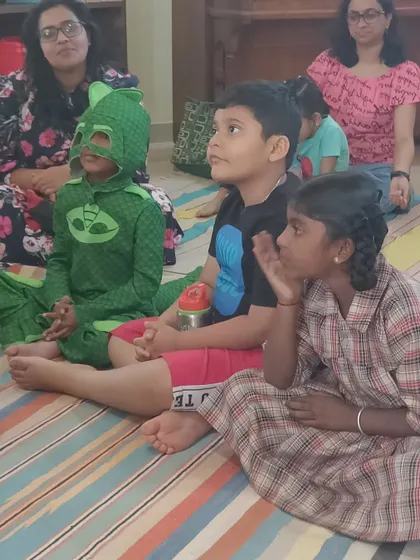 The focused expressions of our young audience, including one little hero in costume, show just how engaging our stories are. We create an atmosphere where imagination can truly run wild.