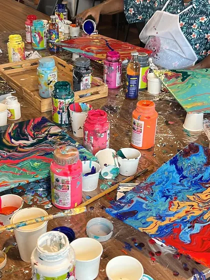 Yesterday was all about color and chaos at our fluid art workshop. The studio was a beautiful mess of poured paint and happy artists.