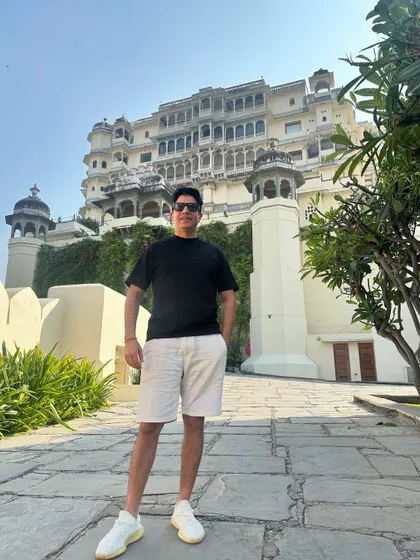 A casual look in front of a magnificent palace in Udaipur. The grandeur of Rajasthan's heritage is always awe inspiring.
