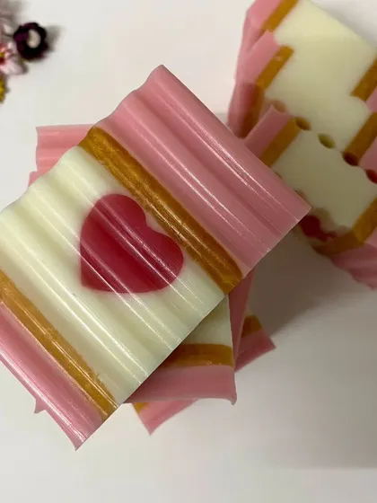 A duplicate of the previous image, showing the consistent quality of my handmade heart-themed soaps.